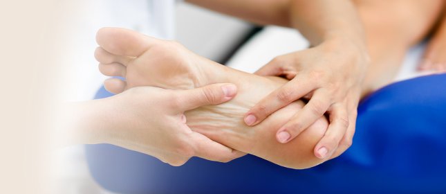 Page header showing clinician assessing patient foot